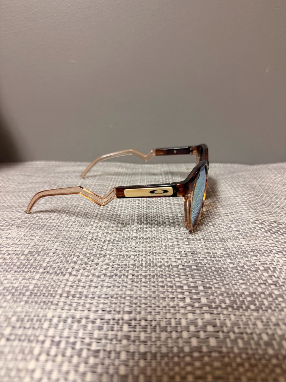 Oakley Tortoiseshell Frame Sunglasses with Blue Lenses